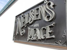 Neilsen's Place Metal Sign