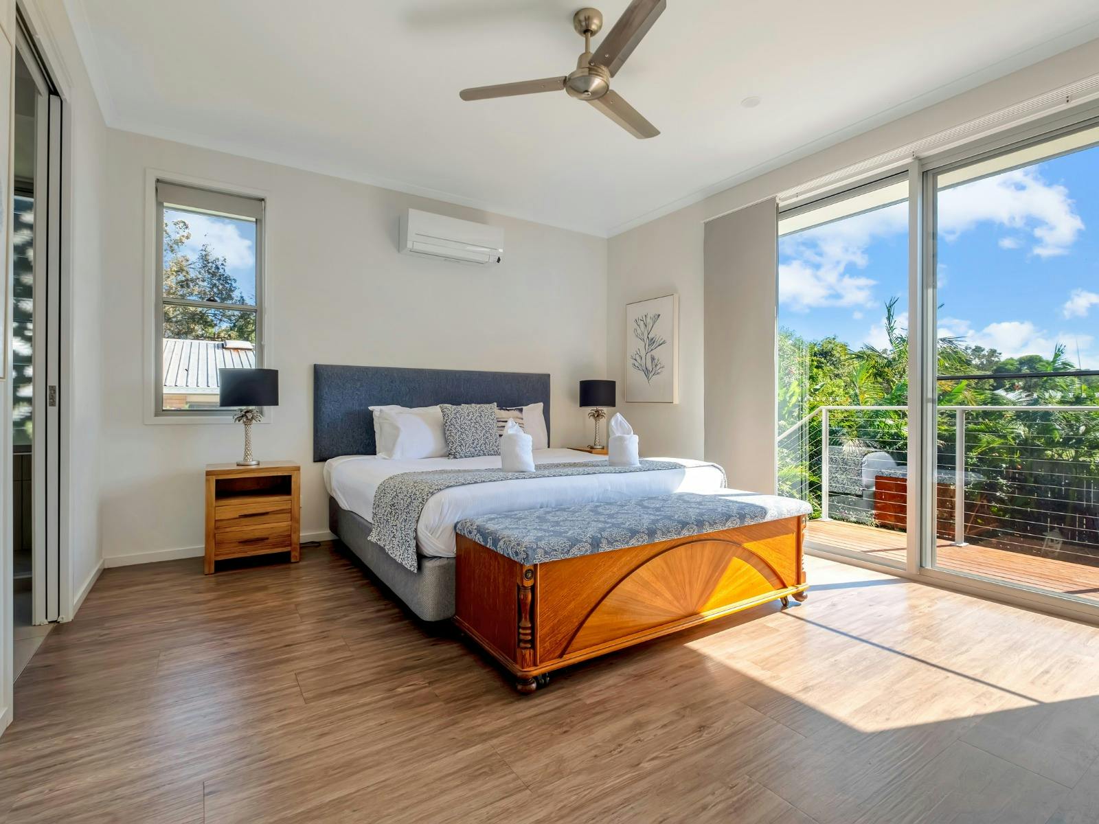 Main bedroom with king size bed, ensuite bathroom and balcony access