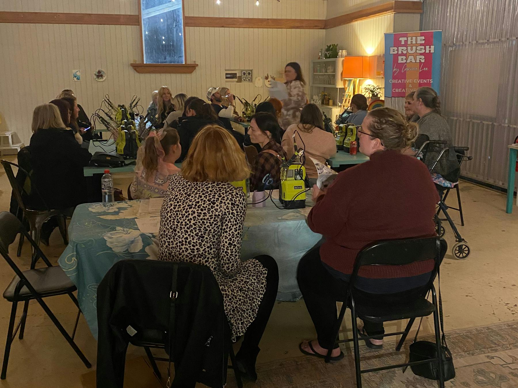 People sat at tables doing a hart burning event