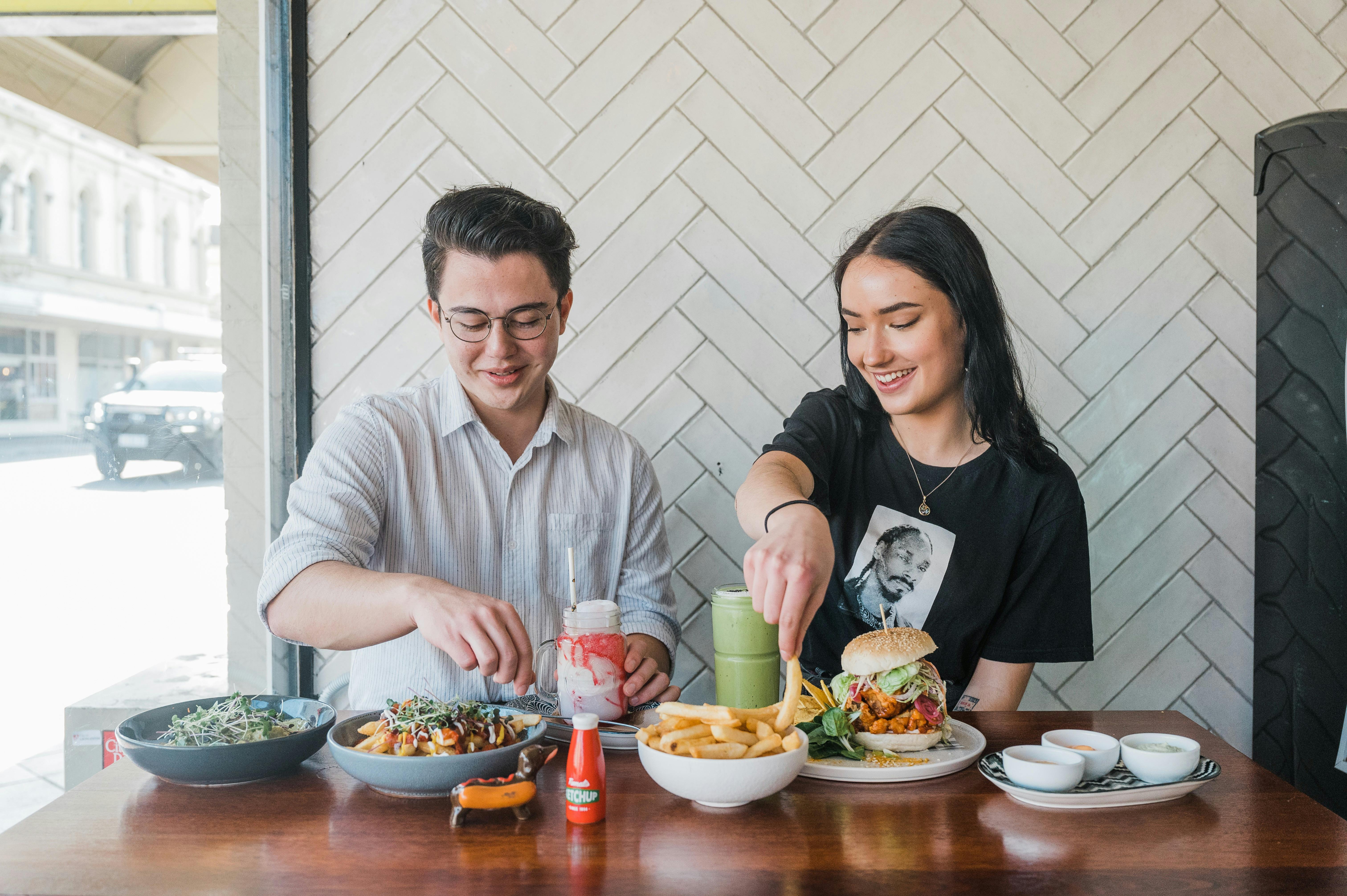 Two people enjoy a meal together