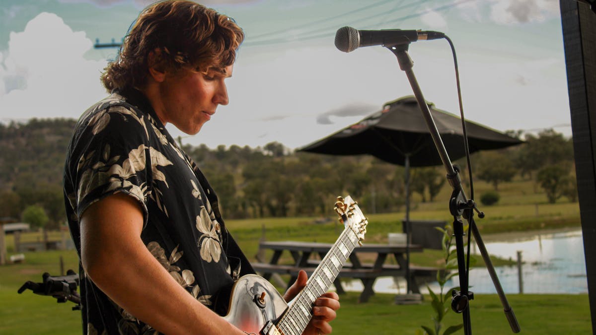 Musician Evan Ayres playing live at Balancing Heart Vineyard on the Granite Belt, South-East Qld