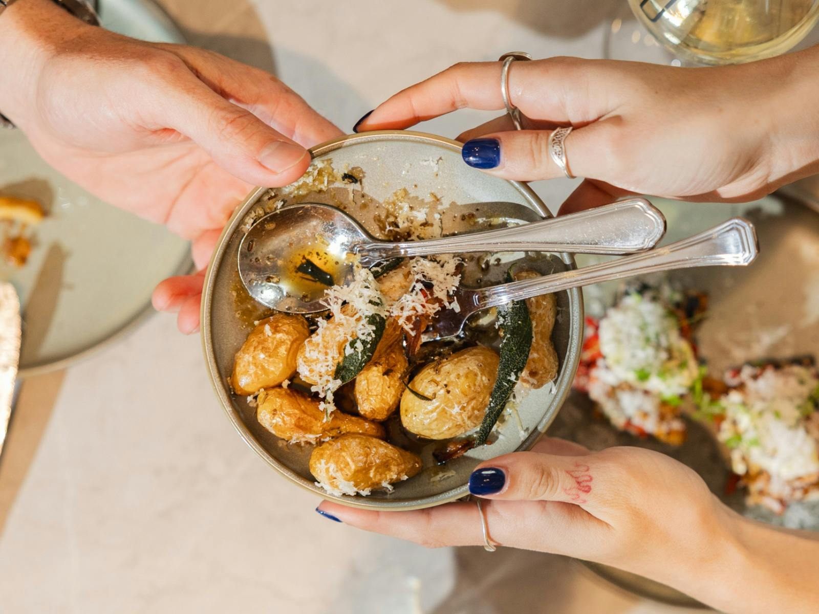 Roast potatoes with parmesan in bowl