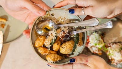 Roast potatoes with parmesan in bowl