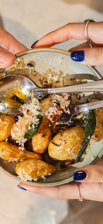 Roast potatoes with parmesan in bowl