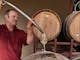 Pouring wine from a barrel into a glass