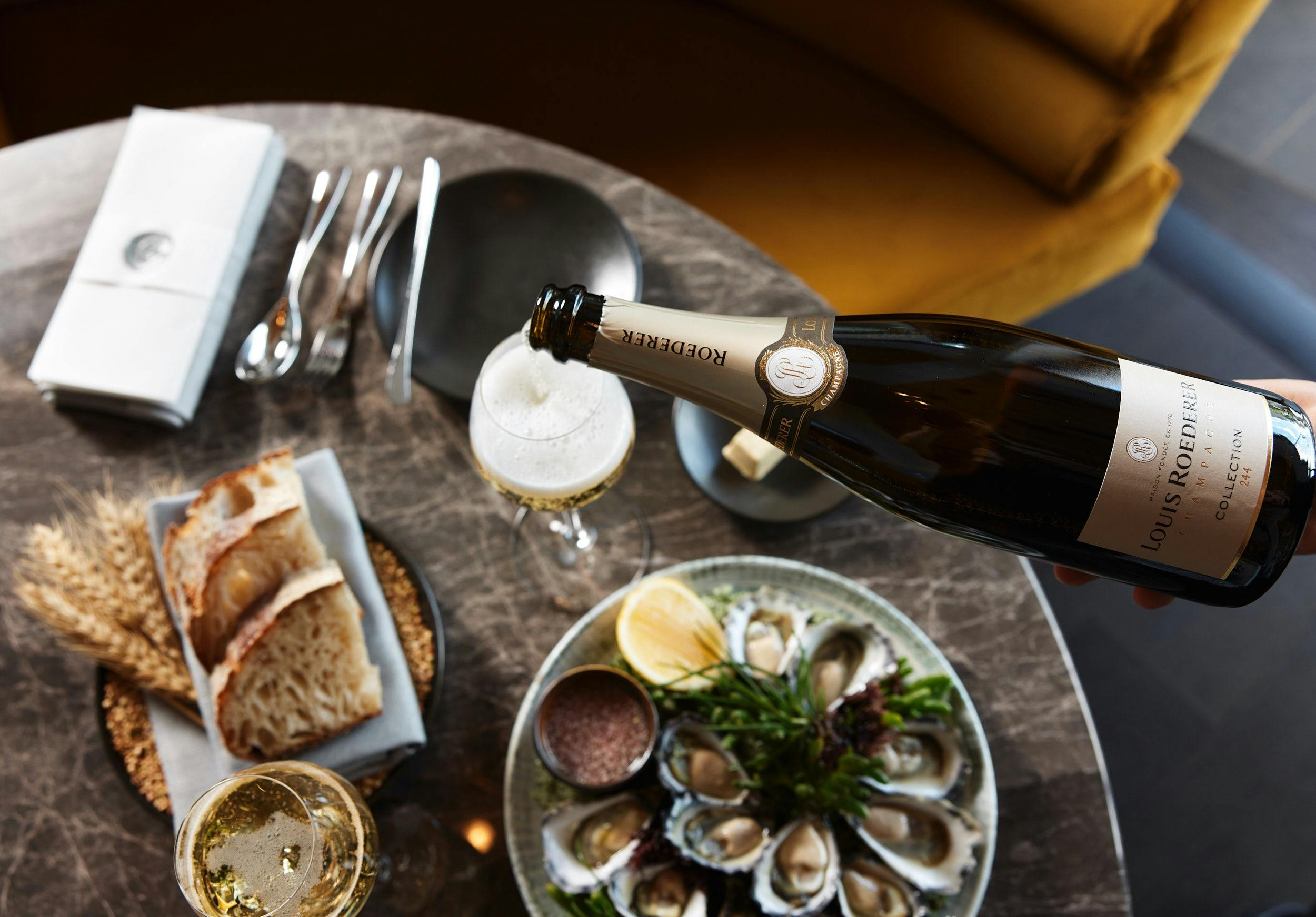 Freshly shucked oysters and premium champagne served at Oborozuki