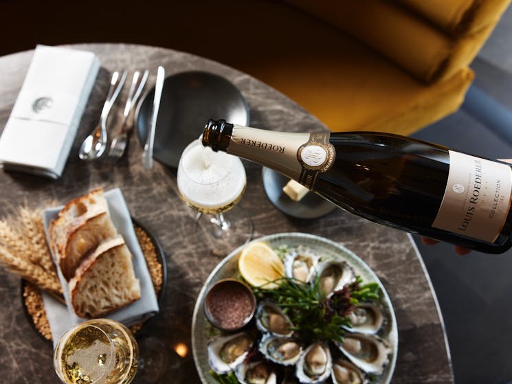 Freshly shucked oysters and premium champagne served at Oborozuki