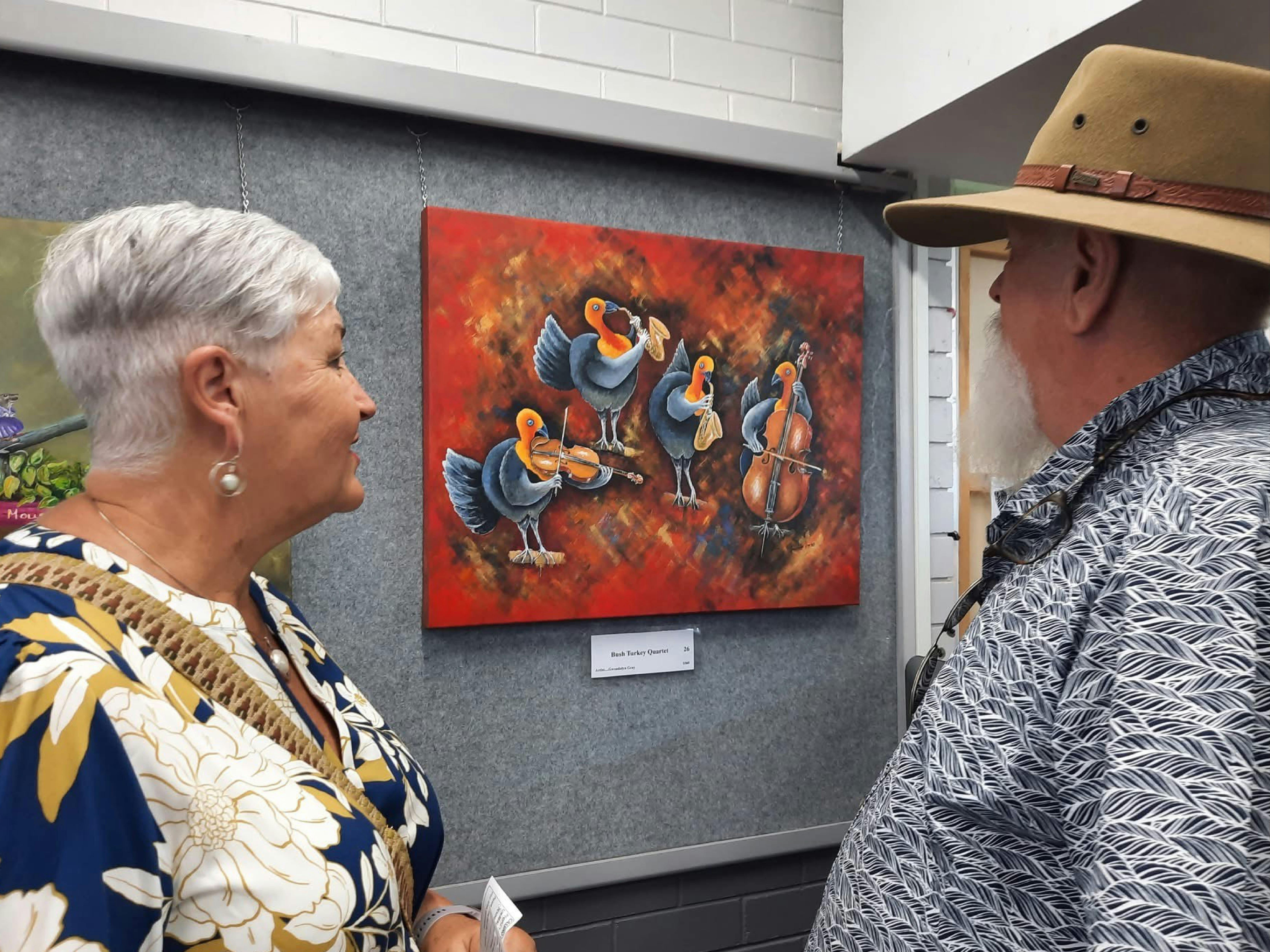 Cassino Gallery art lovers viewing a painting