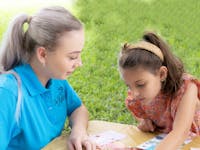 Nannies On A Mission reading with a child