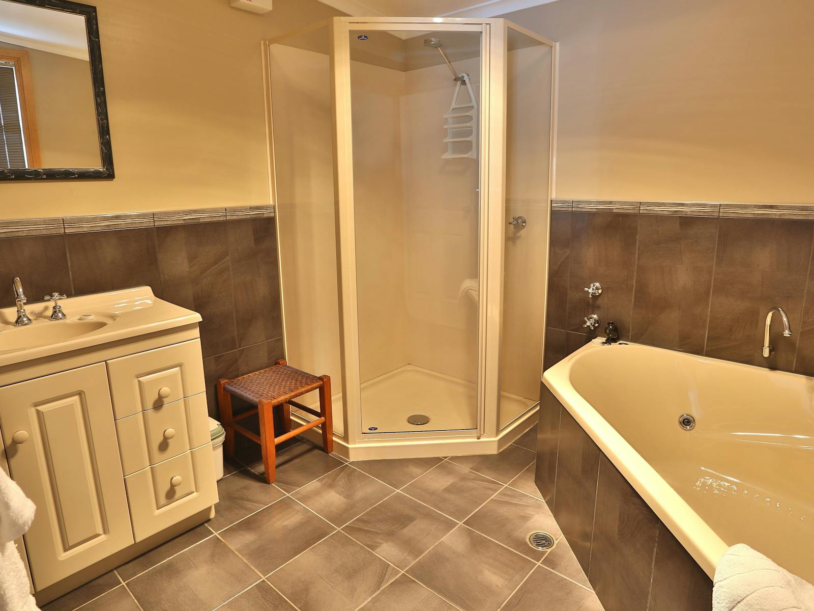 Spacious bathroom with walk in shower, 2 person corner spa