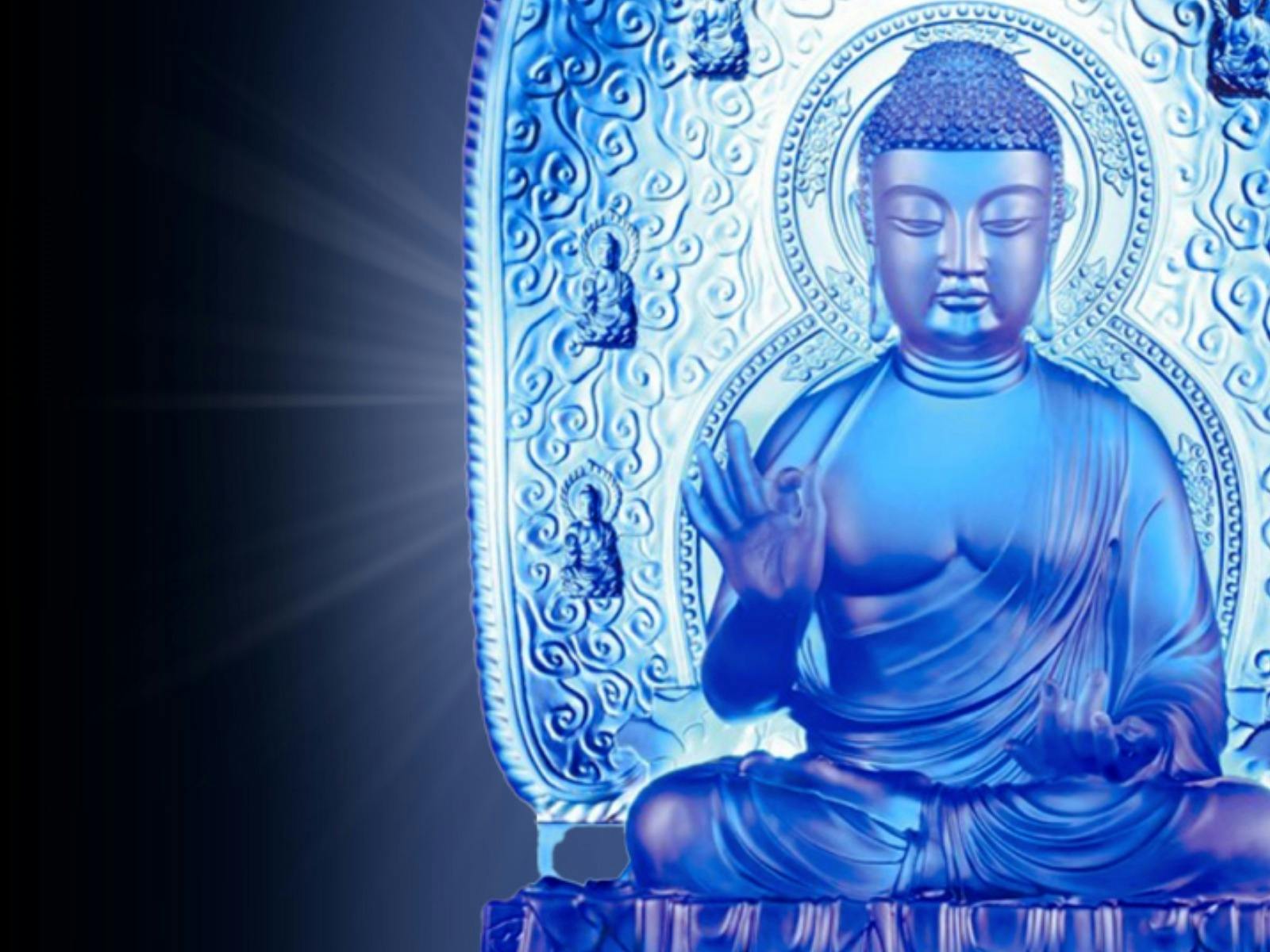 A back lit Blue Buddha statue with a glowing light