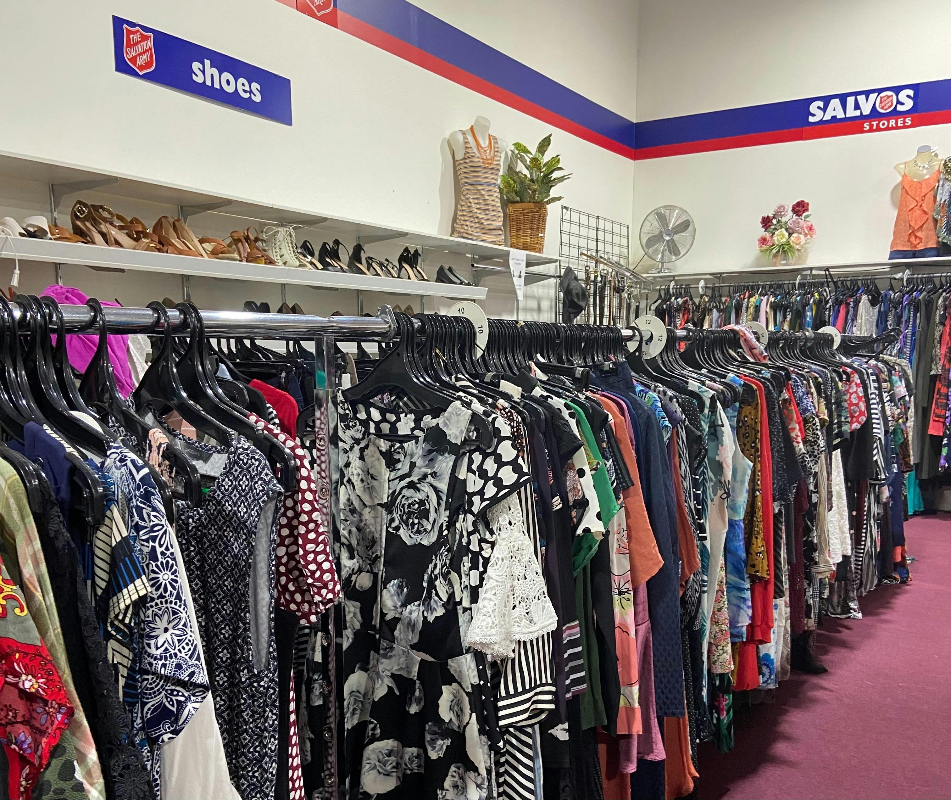 Interior photo showing clothing for sale.