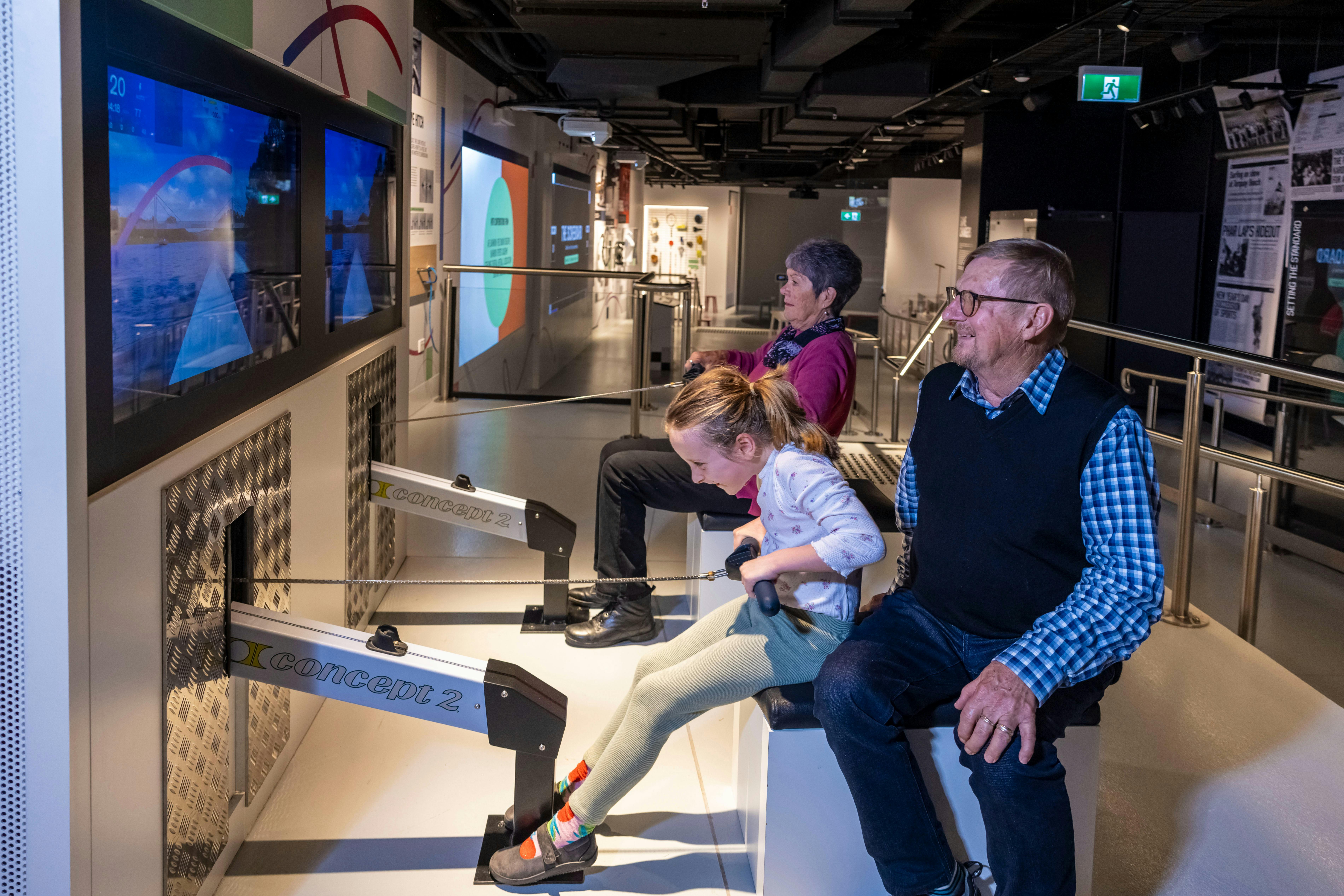 Grandparents and Child using the Rowing Machine activation