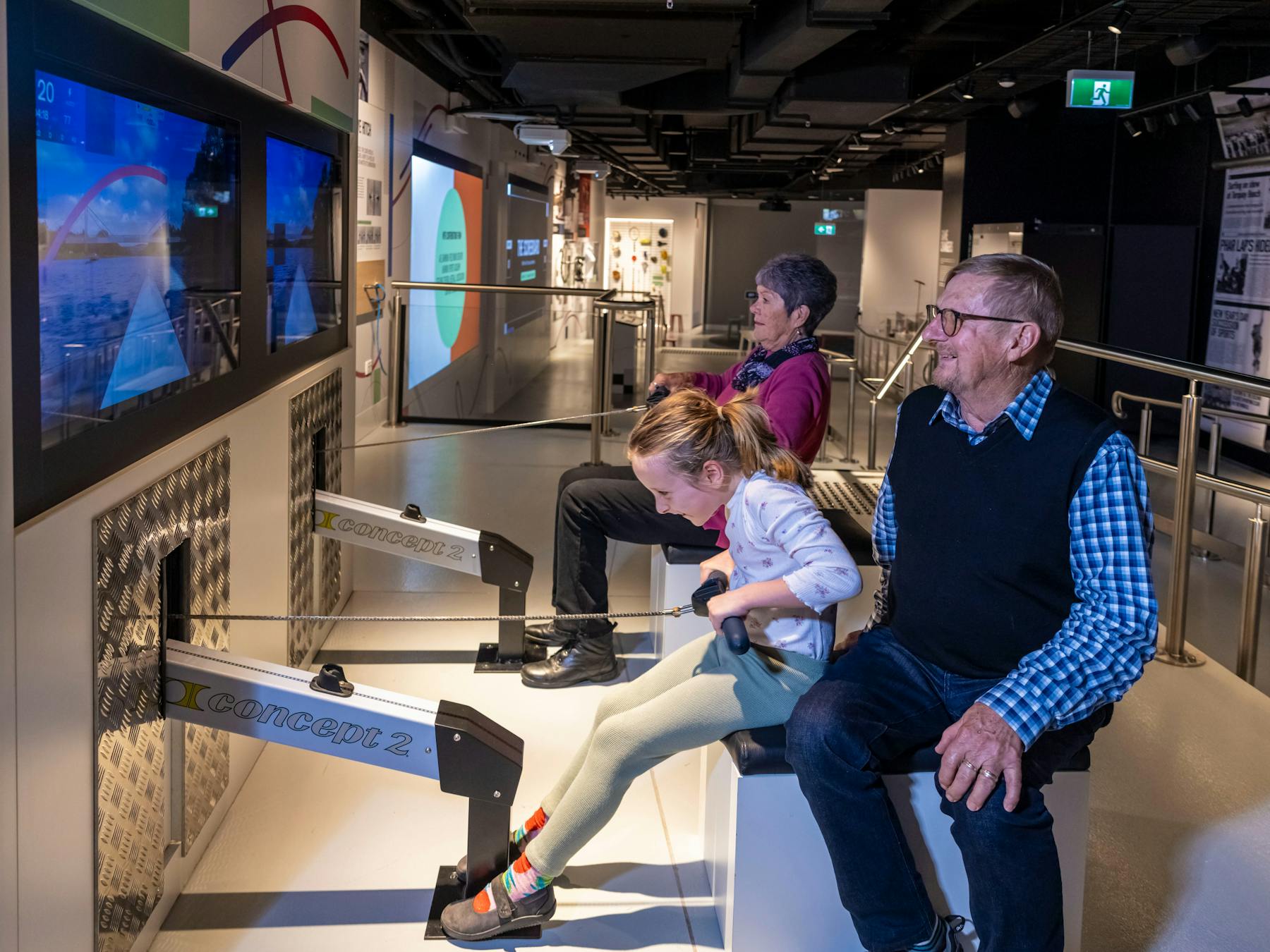 Grandparents and Child using the Rowing Machine activation