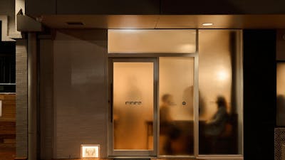 A buzzing restaurant behind frosted glass, subtly hiding what is inside.