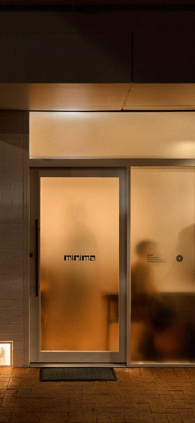 A buzzing restaurant behind frosted glass, subtly hiding what is inside.