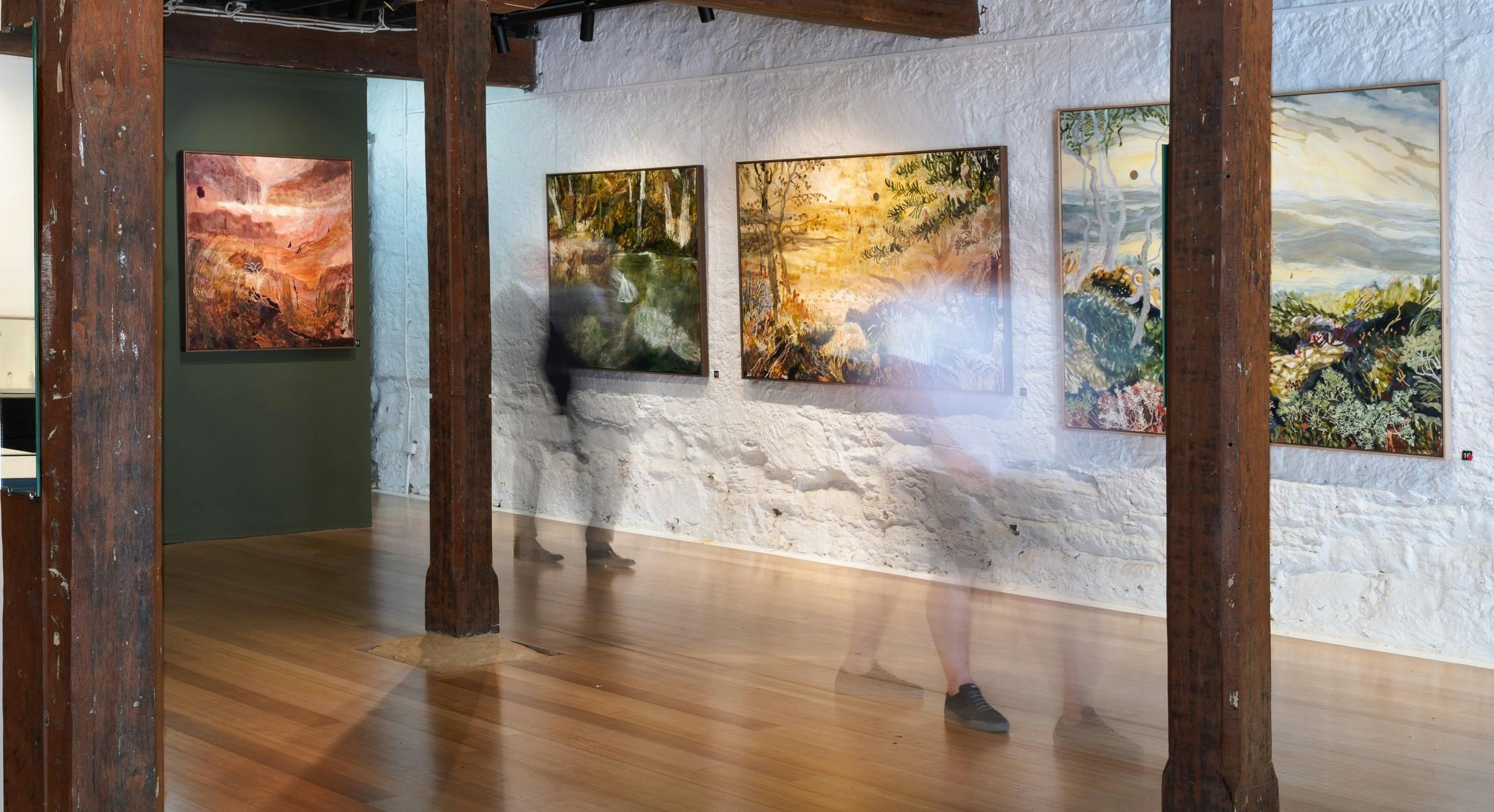 Image of Anna Fitzpatrick's 2024 exhibition titled Sydney to Hobart, with people viewing paintings.