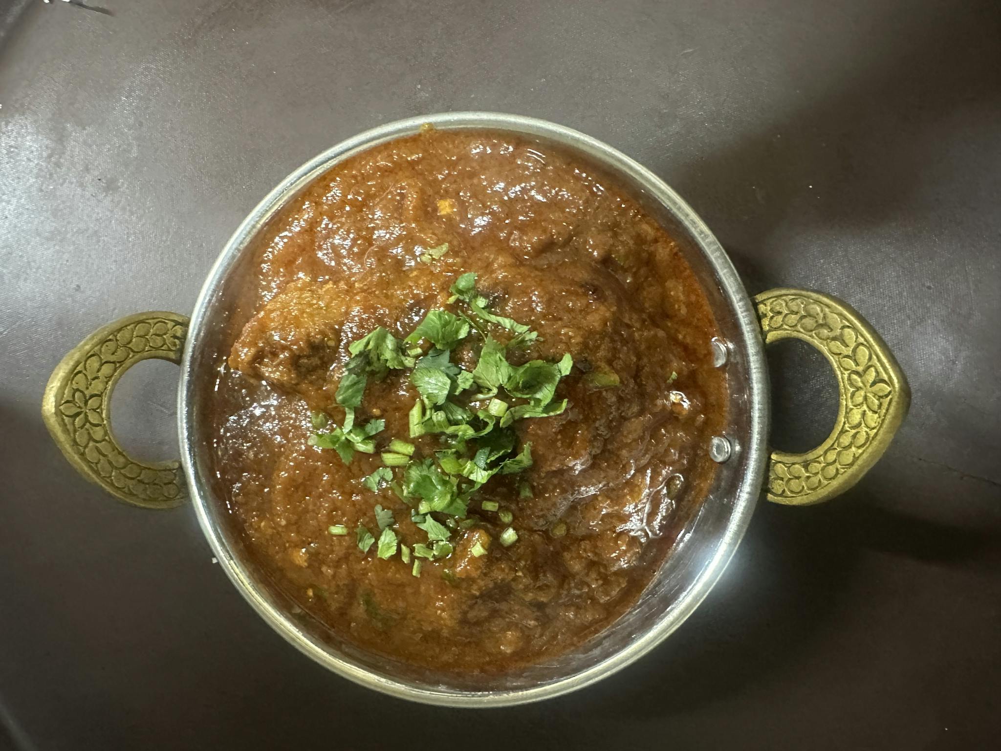 Curry in metal bowl