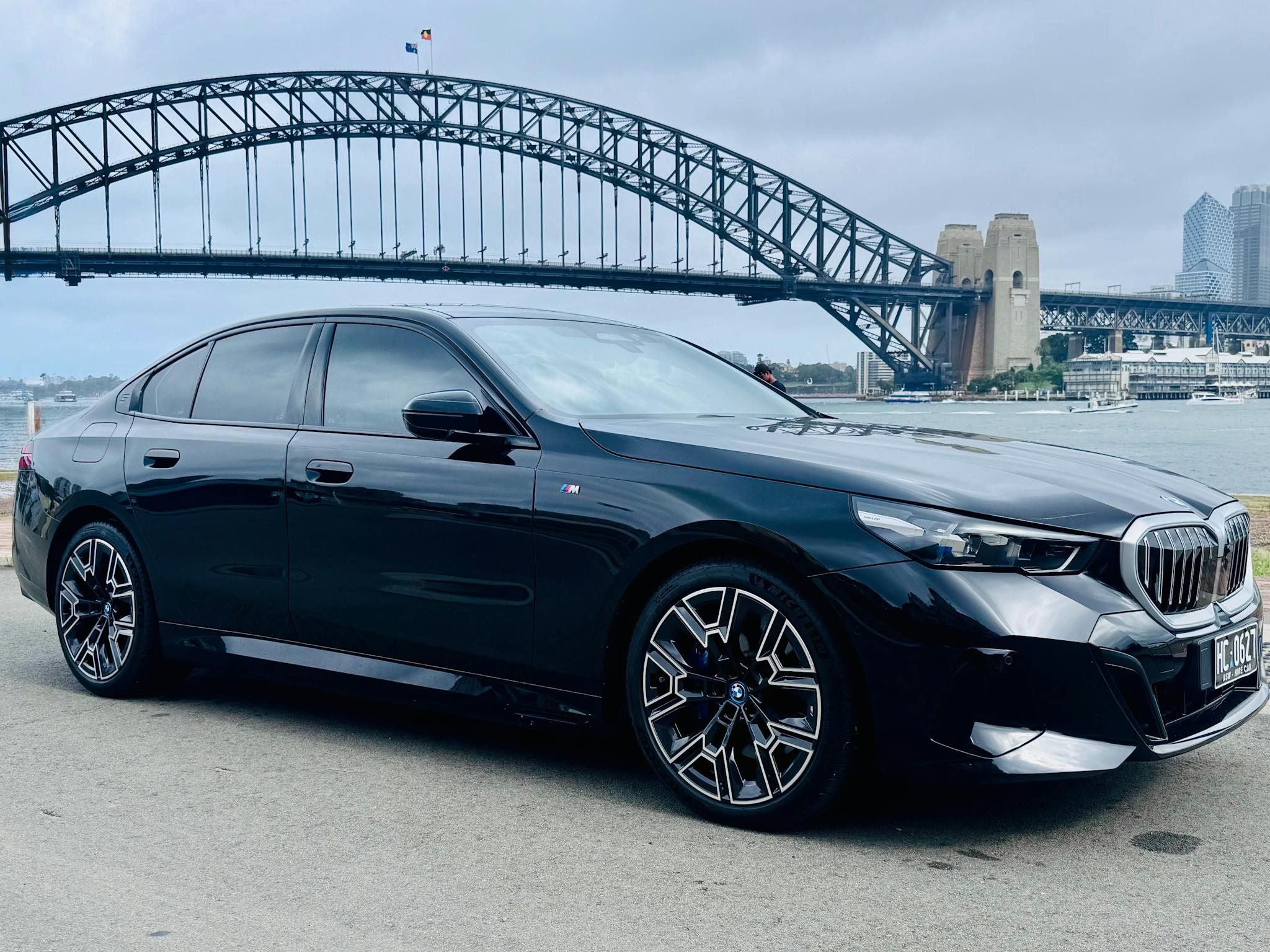 BMW i5 in front of Sydney Harbour Bridge