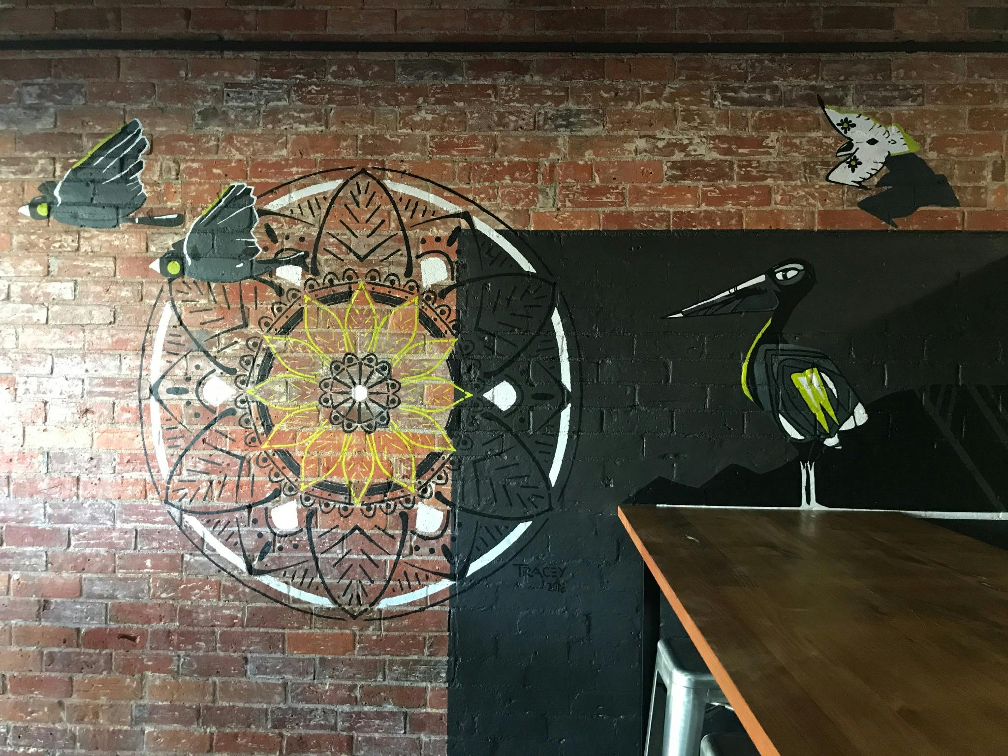 Mural depicting mandala and native fauna