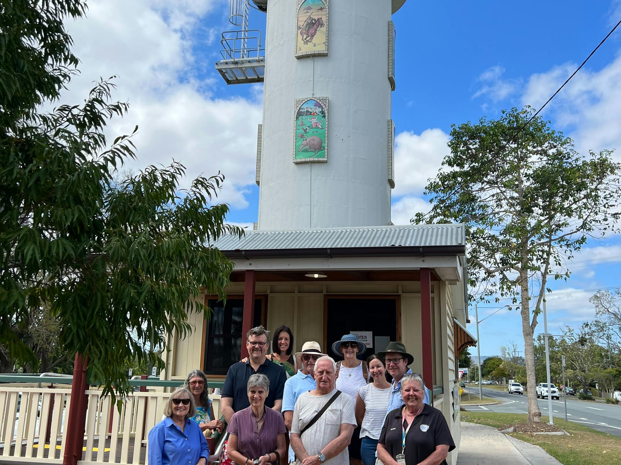 A guide with the walking group tour standing in front of the Woodford Visitor Centre A guide with the walking group tour standing in front of the Woodford Visitor Centre