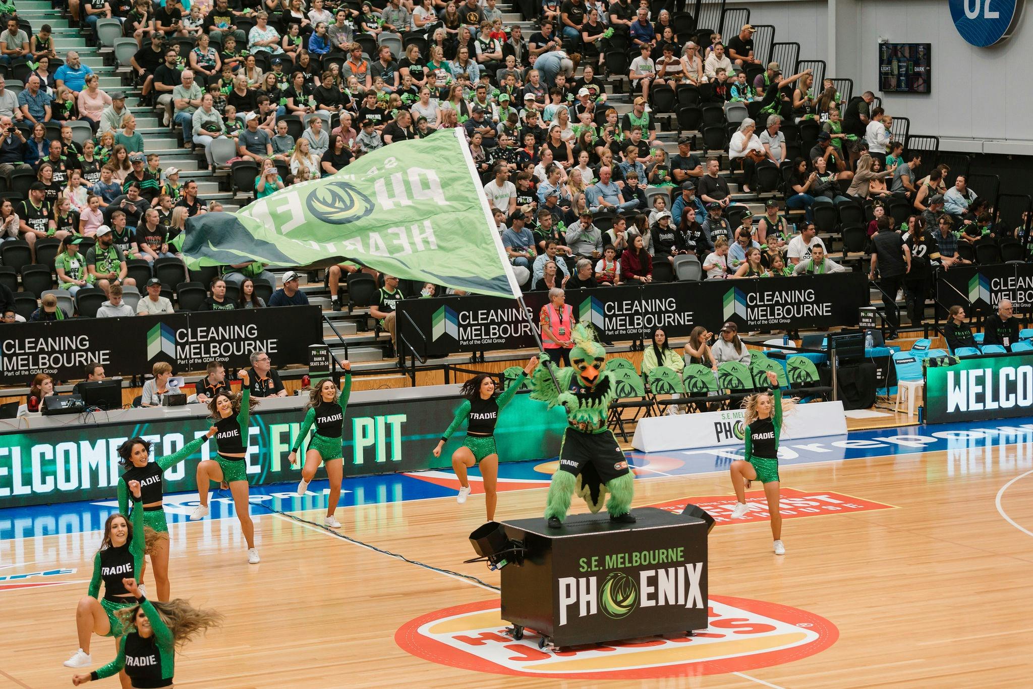 South East Melbourne Phoenix cheer squad dancing with mascot