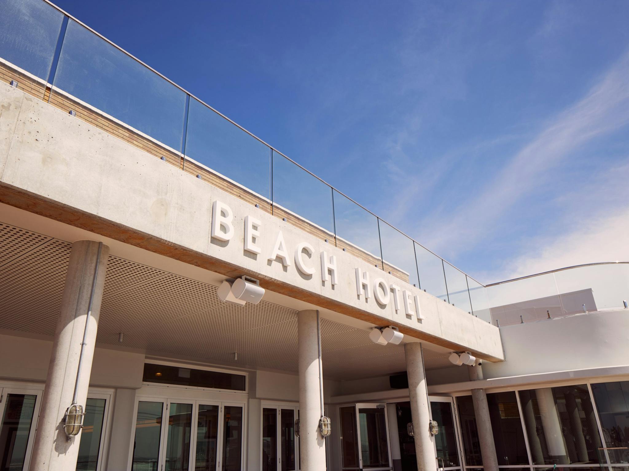 Exterior outside The Beach Hotel on a Sunny day