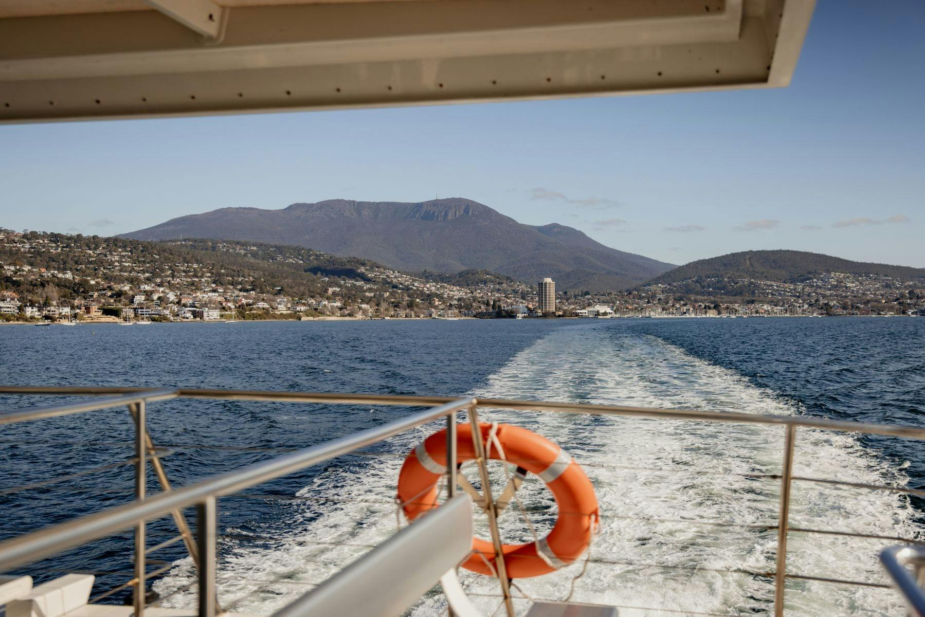 View from back of boat overlooking Mount Wellington/kunanyi and Hobart