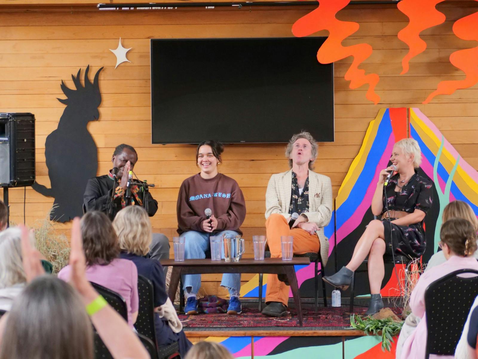 A panel of four artists sharing the stage at Mountain Writers Festical 2024