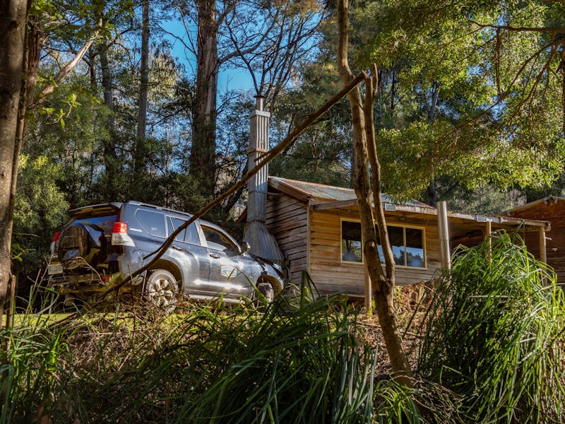 cabin in the bush with tour vehicle