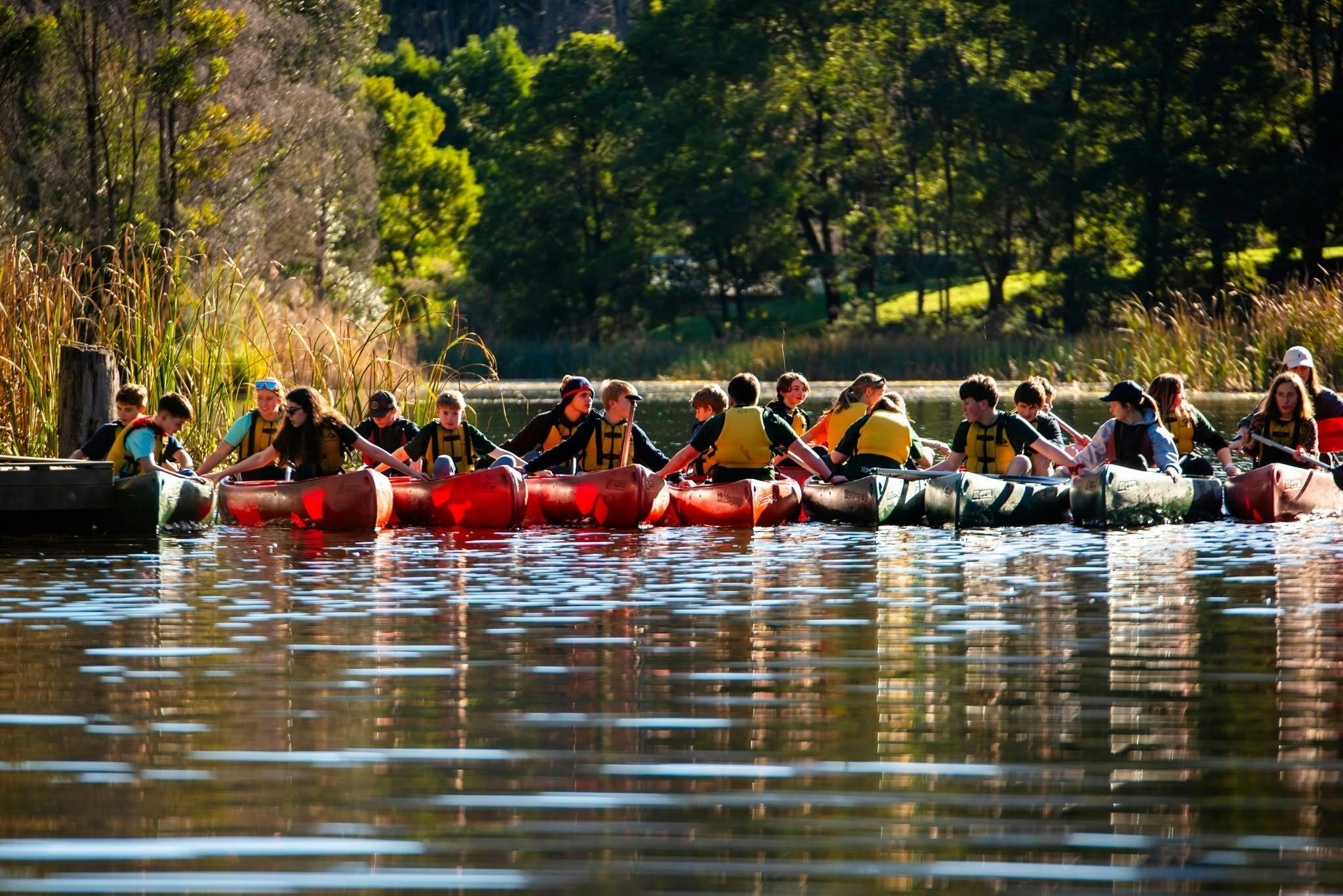 Campers enjoying time in the canoes