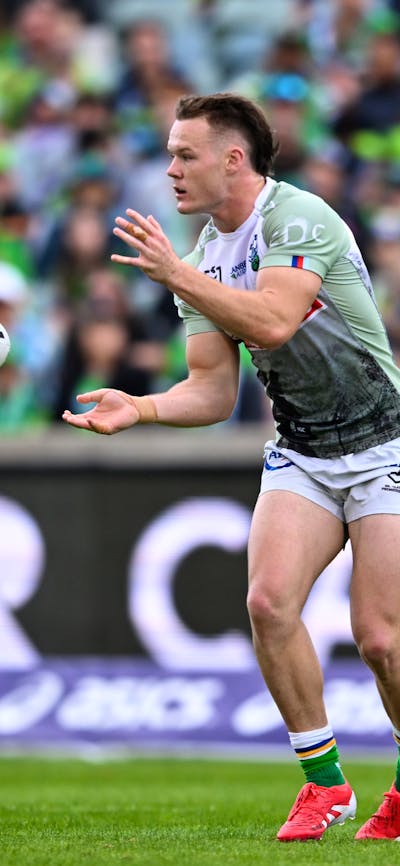 Canberra Raiders player Ethan Strange passing the ball.