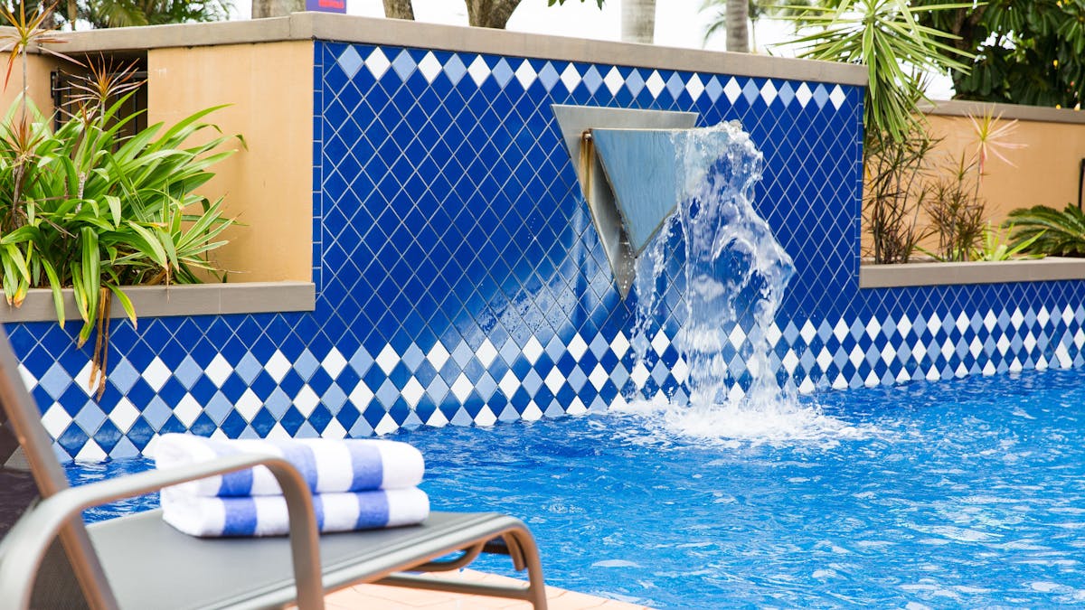 The resort style swimming pool is visible from the bar and restaurant creating the perfect backdrop