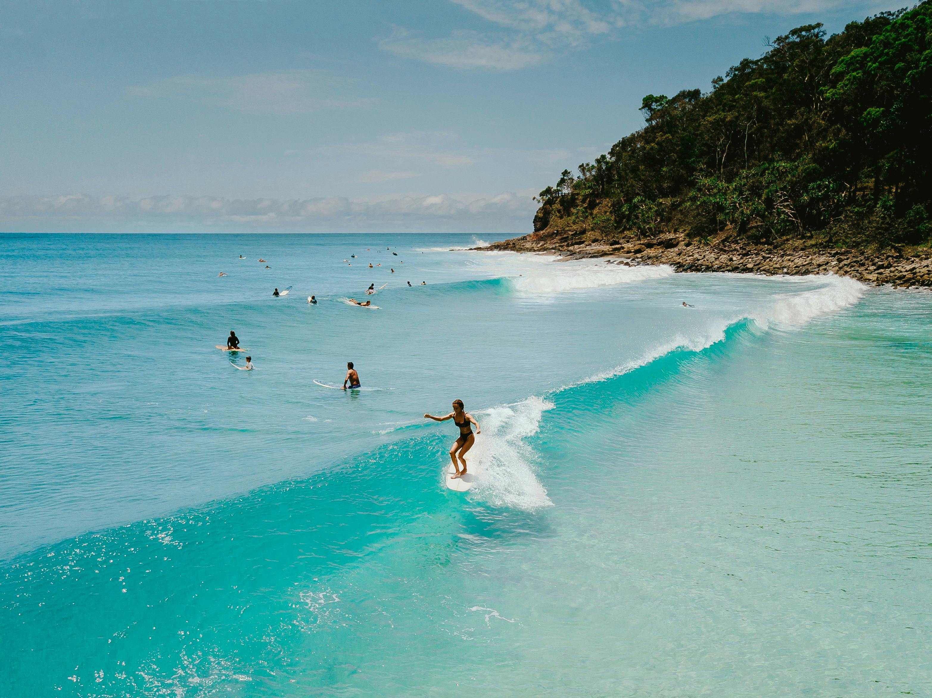 People surfing at Noosa Beach