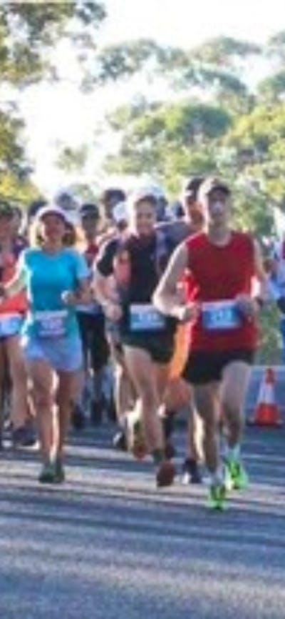 Runners in a bush setting