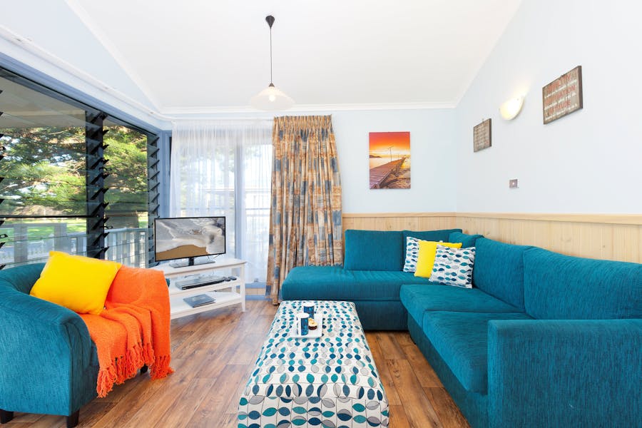 Lounge room in Cabin 15 at Werri Beach Holiday Park