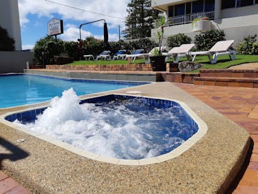 Unwind by the pool and heated spa