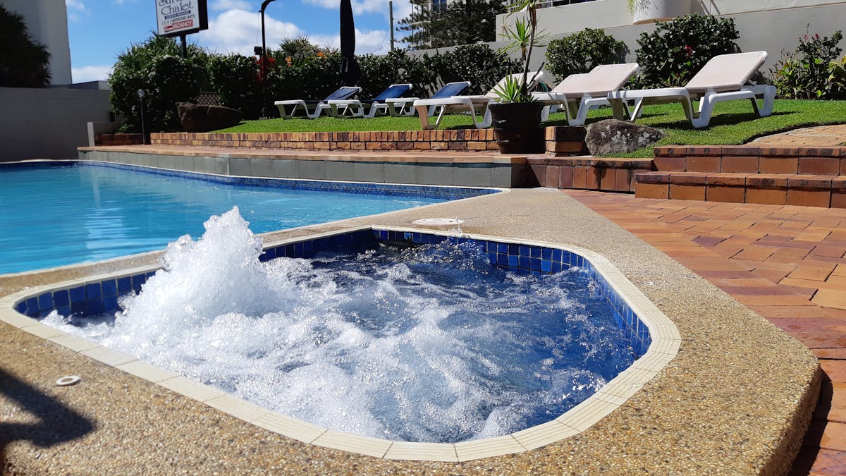 Unwind by the pool and heated spa