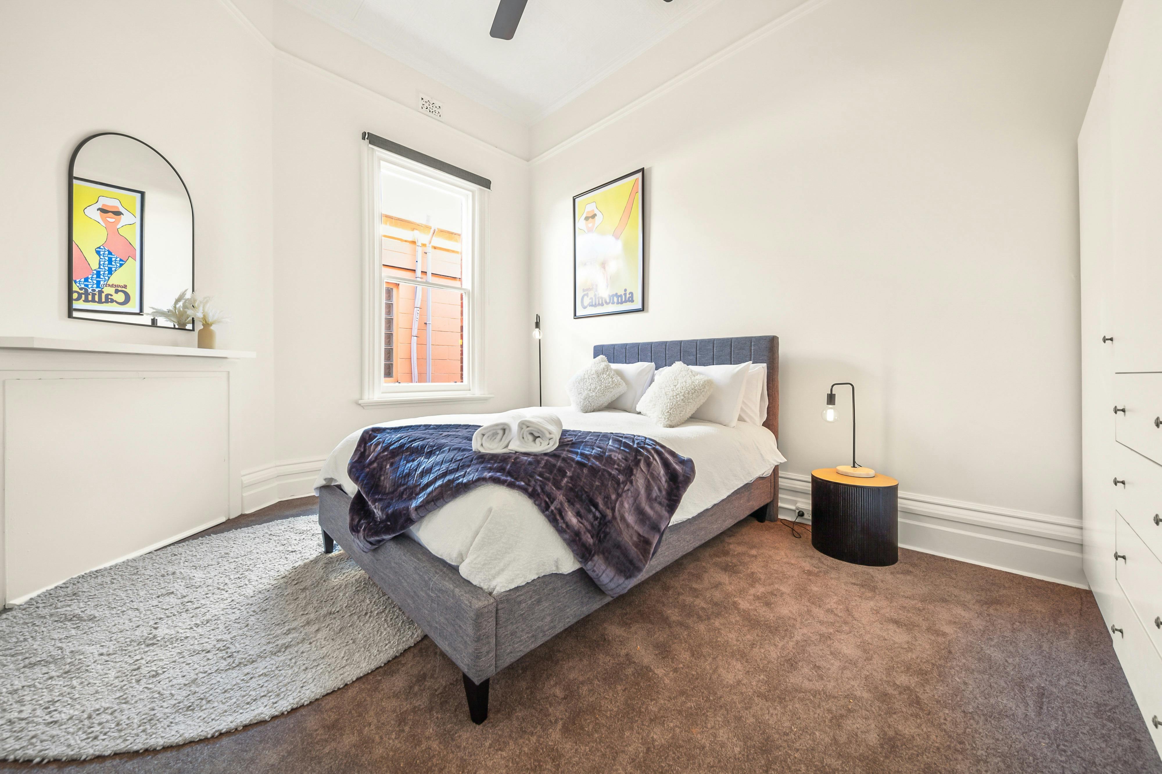 Queen sized bed, bedside tables and bedside lamps