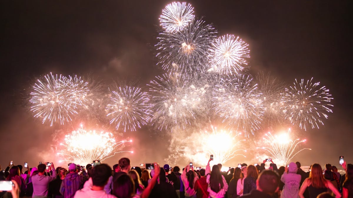 Fireworks over crowd