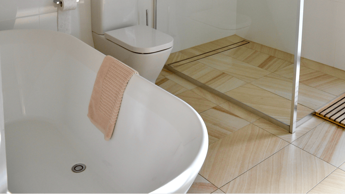 Main bathroom with rain water shower and free standing bathtub.