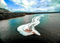 Aerial shot of the Cairns Jet Boat Bad Fishy spinning in the Trinity Inlet in Cairns