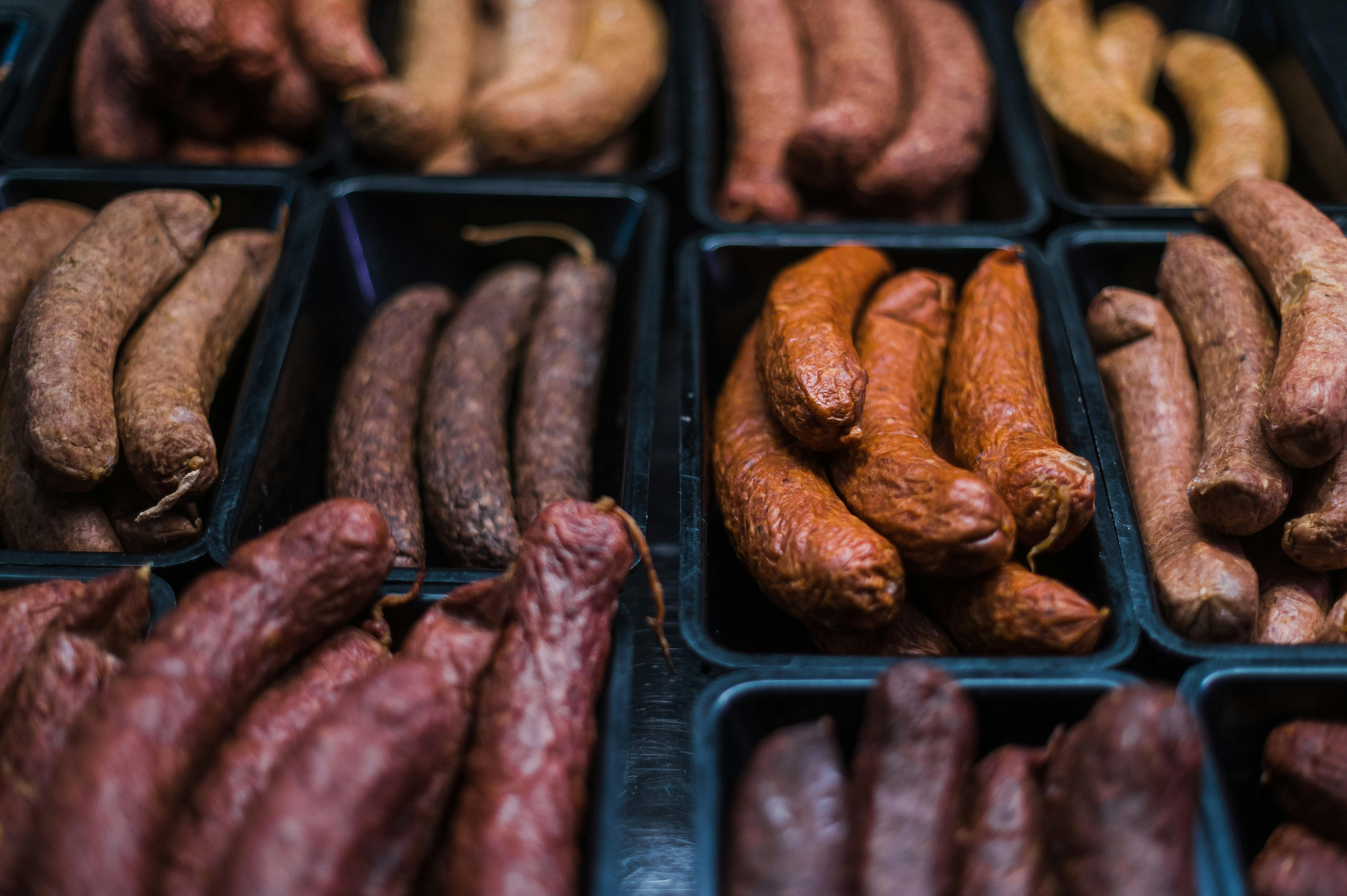 Image shows a range of smoked products including kransky and cabana