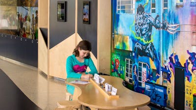 Child playing at a small table and chairs