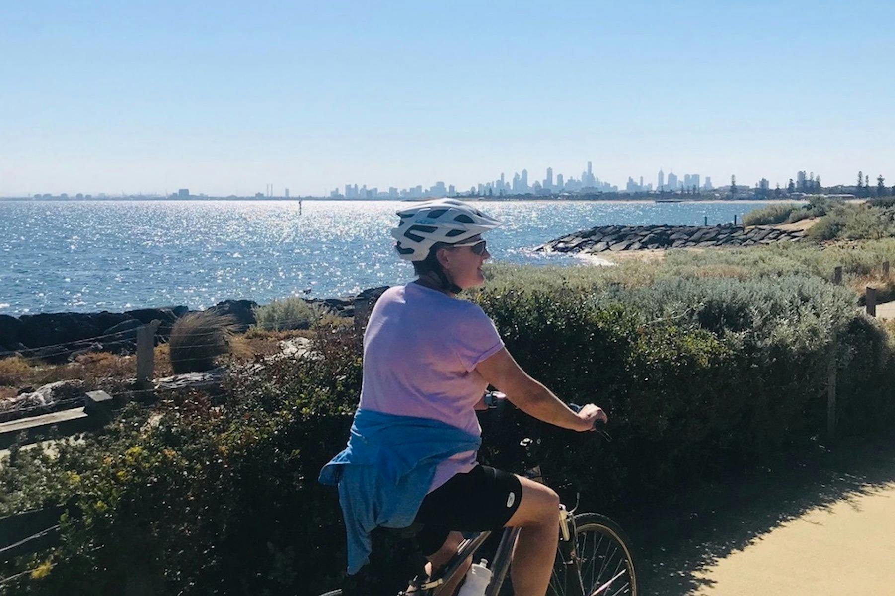 Cycling along the bayside cycle track looking at the melbourne skyline