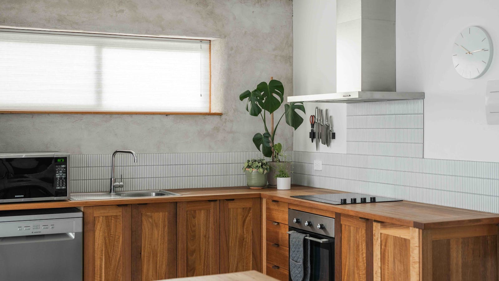 A full kitchen with a range of appliances including NutiBullets, sandwich makers and more.