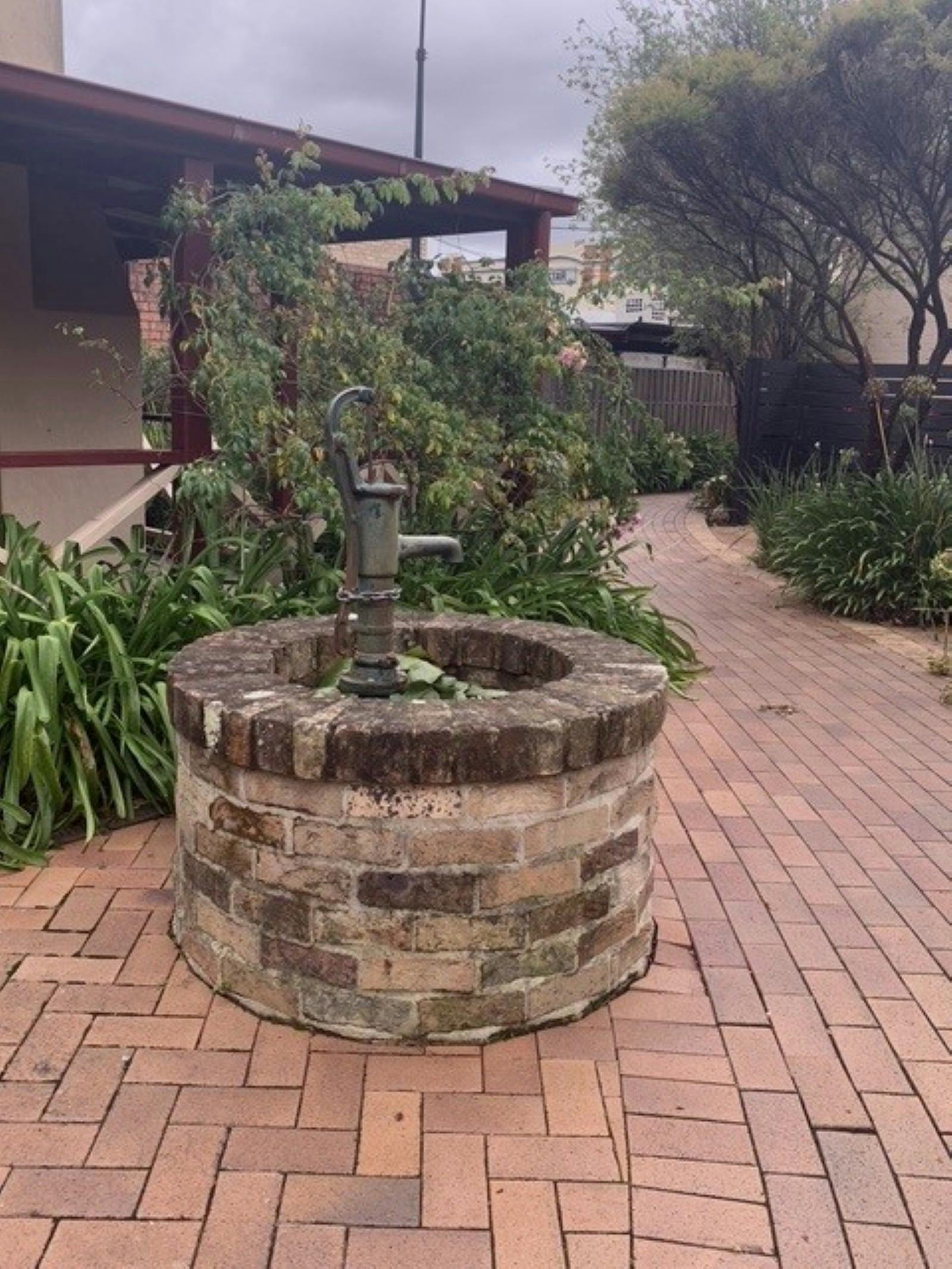Brick well in courtyard at Milton
