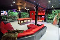 your own private glass bar with pool table, lounge, smart tv, pole dancing , bar and bathroom