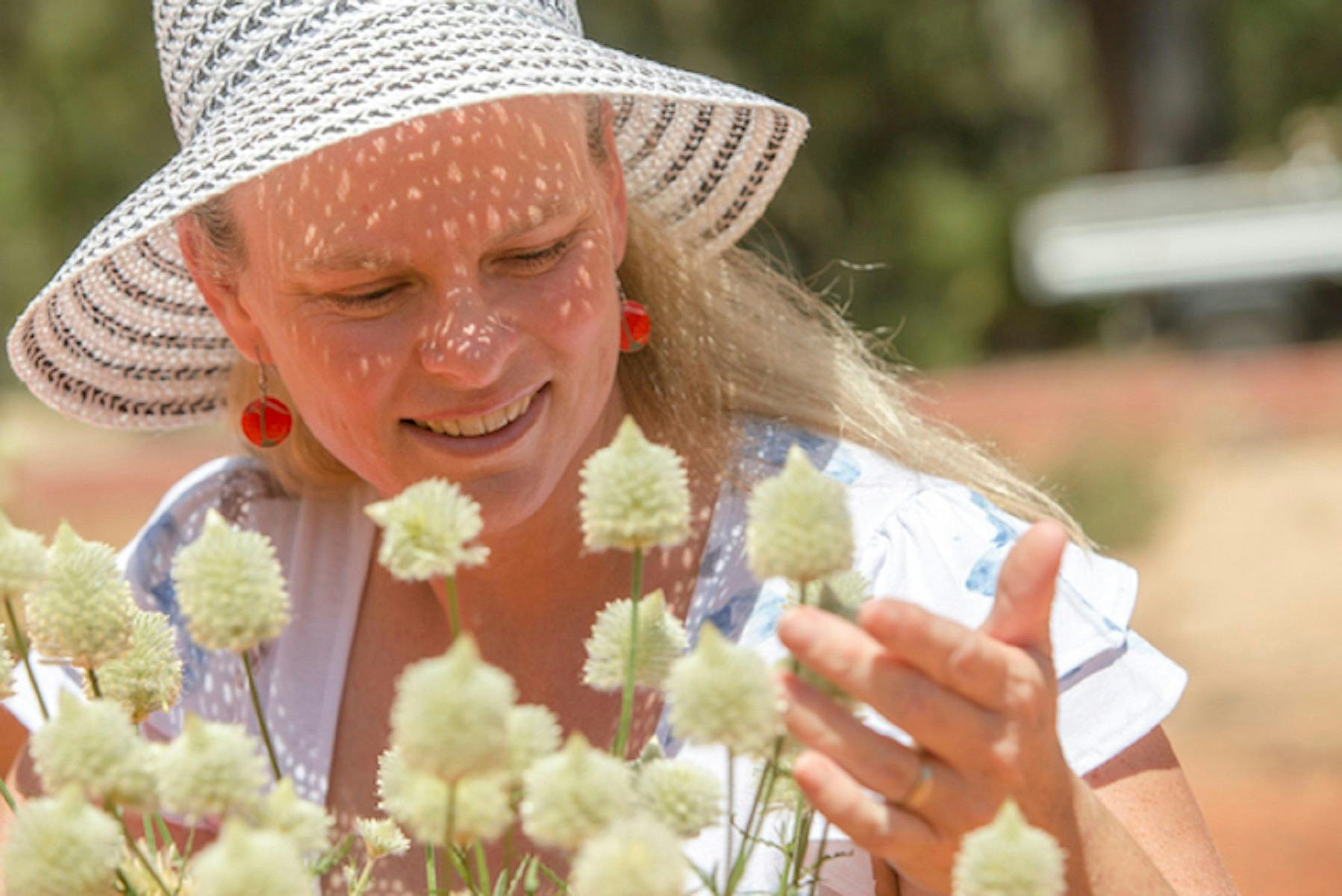 Visitor looking at beautiful white flowers
