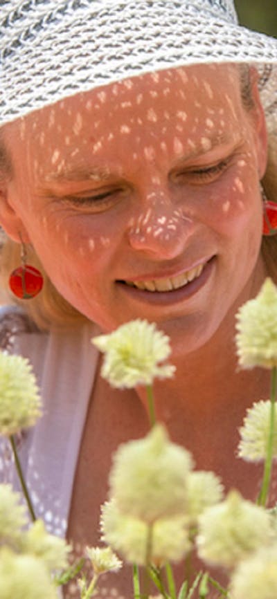 Visitor looking at beautiful white flowers